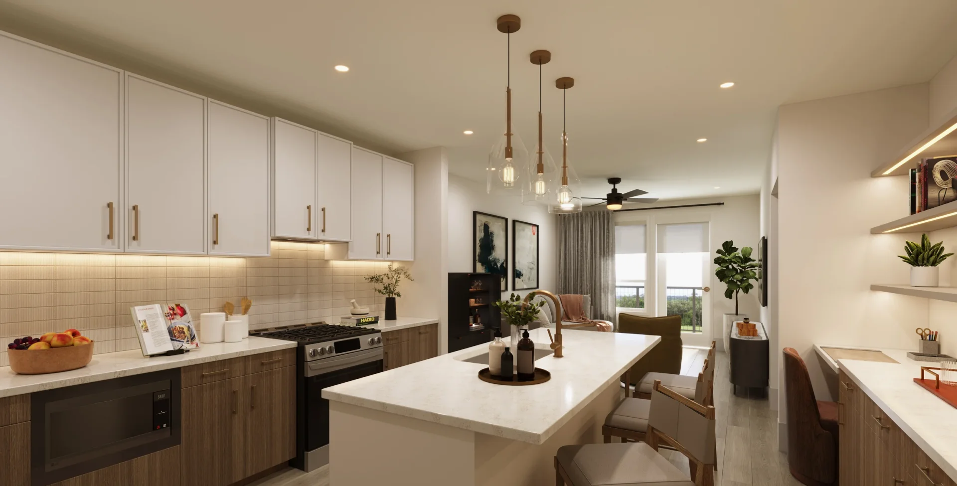 Modern apartment kitchen with large island and built-in workspace at Westbend Residences